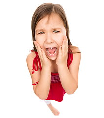 Image showing Little girl is holding her face in astonishment