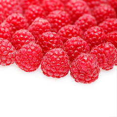 Image showing many raspberry berries isolated on white