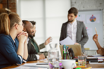 Image showing Group of young business professionals having a meeting, creative office