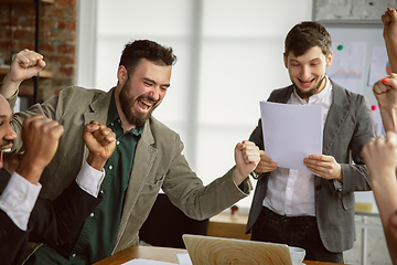 Image showing Group of young business professionals having a meeting, creative office