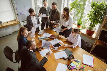 Image showing Group of young business professionals having a meeting, creative office