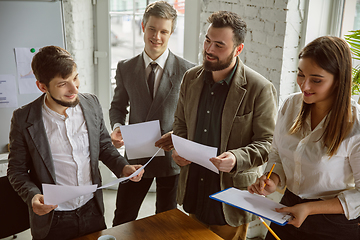 Image showing Group of young business professionals having a meeting, creative office