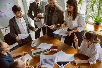 Image showing Group of young business professionals having a meeting, creative office