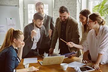 Image showing Group of young business professionals having a meeting, creative office