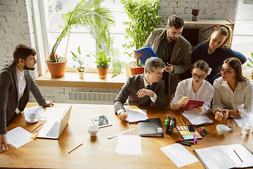 Image showing Group of young business professionals having a meeting, creative office