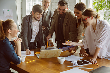 Image showing Group of young business professionals having a meeting, creative office