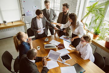 Image showing Group of young business professionals having a meeting, creative office