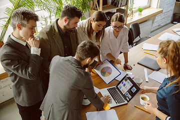 Image showing Group of young business professionals having a meeting, creative office