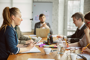 Image showing Group of young business professionals having a meeting, creative office