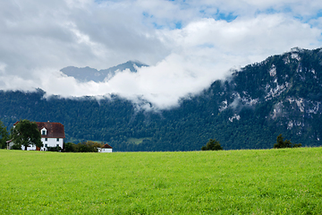 Image showing Beautiful mountains landscape in Switzerland Alps. Small house