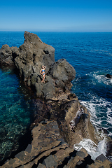 Image showing beautiful girl resting in natural ocean swimming pool