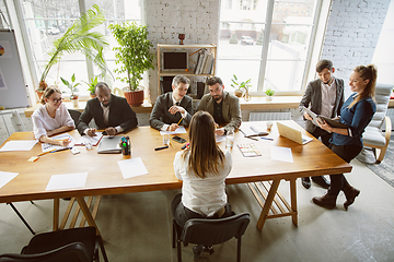 Image showing Group of young business professionals having a meeting, creative office