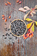 Image showing Barberry dried in bowl on dark board top