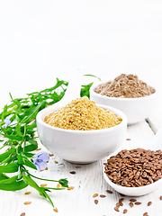 Image showing Bran and flour flaxseed in bowls on white wooden board