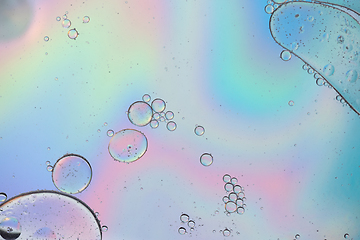 Image showing Holographic colorful abstract background with oil drops on water