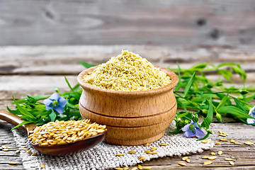 Image showing Bran flaxseed in bowl on wooden board