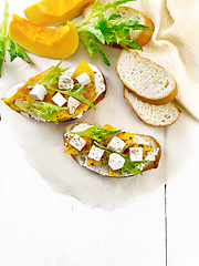 Image showing Bruschetta with pumpkin and ricotta on board top