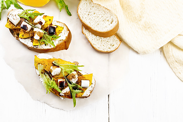 Image showing Bruschetta with pumpkin and sauce on board top