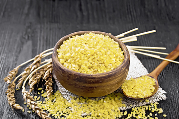 Image showing Bulgur in bowl on board