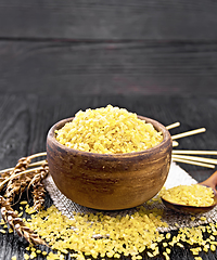 Image showing Bulgur in bowl on wooden board