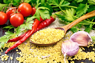 Image showing Bulgur in spoon on table