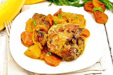 Image showing Chicken roast with pumpkin and carrots on light board