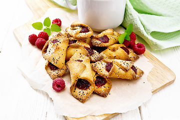 Image showing Cookies with raspberries on board