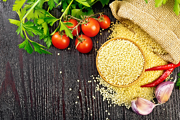 Image showing Couscous raw in bowl on black board top