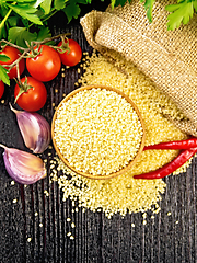 Image showing Couscous raw in bowl on dark board top