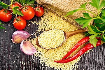 Image showing Couscous raw in spoon on board top