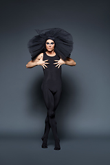 Image showing handsome ballet artist in tutu skirt