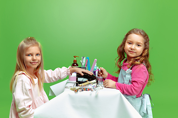 Image showing Little girl dreaming about future profession of nails manicure artist