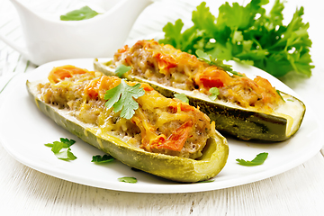 Image showing Cucumber stuffed with meat and vegetables on board