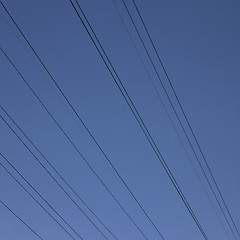 Image showing black electric wires in the blue sky
