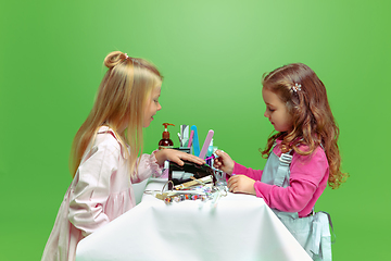 Image showing Little girl dreaming about future profession of nails manicure artist