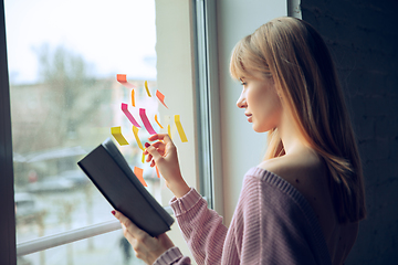 Image showing Beautiful caucasian business lady working in office, open-space