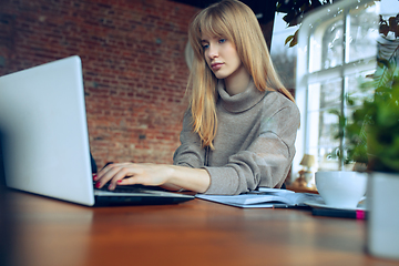 Image showing Beautiful caucasian business lady working in office with laptop