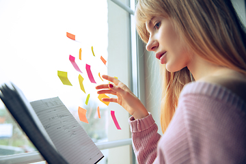 Image showing Beautiful caucasian business lady working in office, open-space