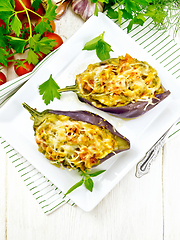 Image showing Eggplant stuffed smoked brisket in plate on white board top