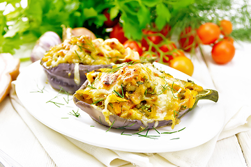 Image showing Eggplant stuffed smoked brisket in plate on wooden board