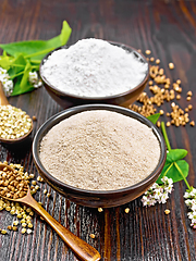 Image showing Flour buckwheat brown and green in bowls on wooden board