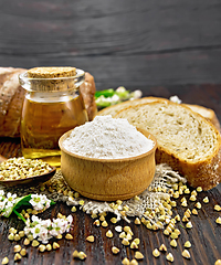 Image showing Flour buckwheat green in bowl with bread on table