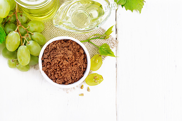 Image showing Flour grape seed in bowl on board top