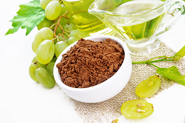 Image showing Flour grape seed in bowl on light board