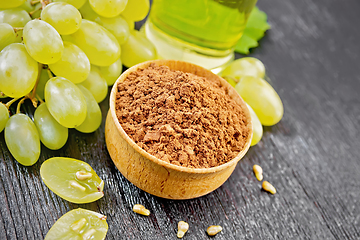 Image showing Flour grape seed in bowl on wooden board