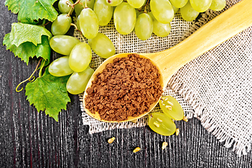 Image showing Flour grape seed in spoon on board top