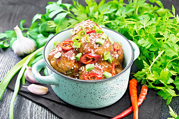 Image showing Meatballs in sweet and sour sauce on black board