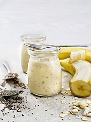 Image showing Milkshake with chia and banana in two jars on table