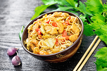 Image showing Noodles with cabbage and chicken in bowl on board