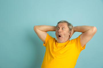 Image showing Caucasian senior man\'s portrait isolated on blue studio background